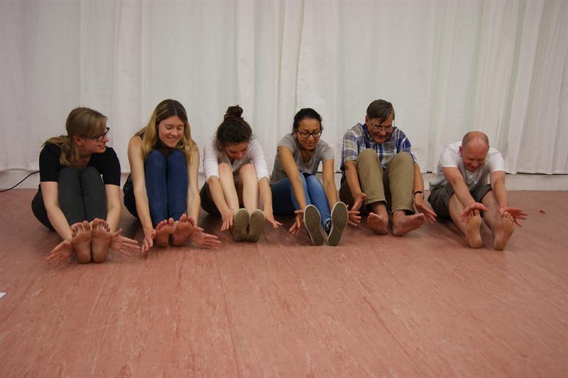 people practising acting exercises