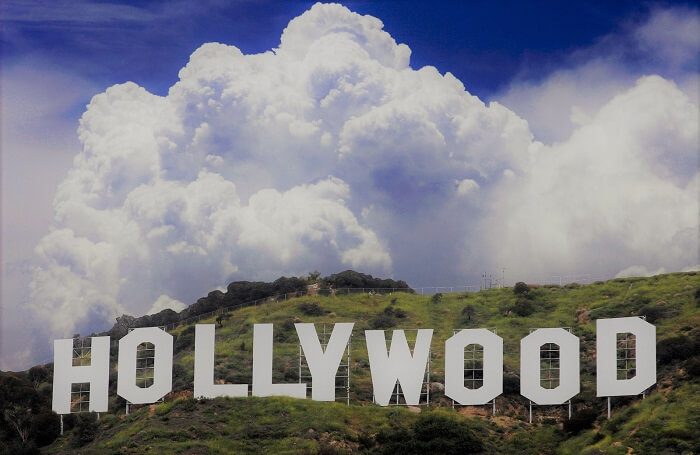 hollywood sign with white clouds and blue sky