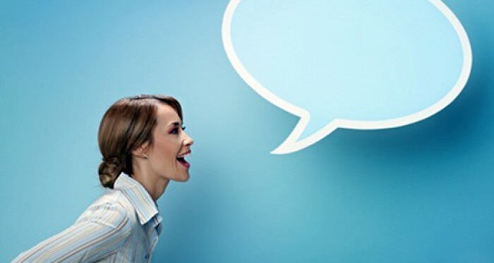 Woman speaking with a speech bubble next to her