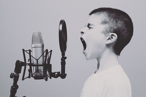 a child practicing vocalization